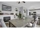Open dining area with fireplace and view into the modern kitchen at 2432 S Genoa Way, Aurora, CO 80013