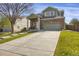 Charming two-story home with brick and siding, a spacious driveway, and a well-manicured front lawn at 2432 S Genoa Way, Aurora, CO 80013