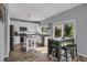 Kitchen with island, stainless appliances, white cabinetry, and eating nook with backyard access at 2432 S Genoa Way, Aurora, CO 80013