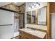 Bathroom with a stone shower and a wooden vanity with a single sink at 47 Forest Cir, Breckenridge, CO 80424