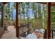 Deck with stone columns and tall trees at 47 Forest Cir, Breckenridge, CO 80424