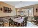Cozy dining room featuring a rustic table, wood accents, and natural light with views of the outdoor scenery at 47 Forest Cir, Breckenridge, CO 80424