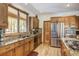 Well-lit kitchen featuring wood cabinets, granite countertops, and stainless steel appliances at 47 Forest Cir, Breckenridge, CO 80424