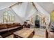 Inviting living room features vaulted ceilings, large windows with beautiful outdoor views and cozy seating at 47 Forest Cir, Breckenridge, CO 80424