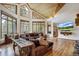 Spacious living area with wood floors, large windows, and a cozy sectional sofa at 47 Forest Cir, Breckenridge, CO 80424