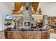 Stunning living room with a stone fireplace, soaring ceilings, wood accents, and mountain views for cozy gatherings at 47 Forest Cir, Breckenridge, CO 80424