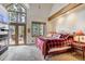 Bright bedroom featuring large windows, a private balcony, and mountain views creating a cozy, tranquil space at 47 Forest Cir, Breckenridge, CO 80424
