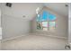 Light-filled bedroom with a high ceiling and large windows offer scenic views at 47032 Frasier Fir Cir, Parker, CO 80138