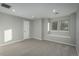 Cozy bedroom with natural light from multiple windows and neutral-toned carpet at 47032 Frasier Fir Cir, Parker, CO 80138