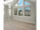 Bright bedroom featuring high ceilings and multiple windows with scenic views at 47032 Frasier Fir Cir, Parker, CO 80138