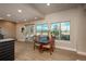 Bright dining area features a table, large windows with a lovely view, and attractive wood flooring at 47032 Frasier Fir Cir, Parker, CO 80138