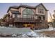 Exterior view featuring a multi-story home with large windows and a deck at 47032 Frasier Fir Cir, Parker, CO 80138