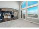 Open-concept living space connects kitchen to Gathering room, featuring hardwood floors and expansive windows at 47032 Frasier Fir Cir, Parker, CO 80138