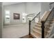 Bright living space with soaring ceilings, staircase and large windows offering view at 47032 Frasier Fir Cir, Parker, CO 80138