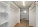 Large walk-in closet with shelves and hanging rods offers lots of storage space at 47032 Frasier Fir Cir, Parker, CO 80138