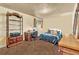 Bedroom featuring carpeted floors, a closet, and a desk at 11953 Us Highway 285, Conifer, CO 80433