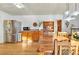 Spacious dining room features stainless steel refrigerator, wood table and wood cabinets at 11953 Us Highway 285, Conifer, CO 80433