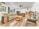 Inviting living room featuring hardwood floors, a ceiling fan and comfortable furnishings at 11953 Us Highway 285, Conifer, CO 80433