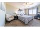 Relaxing main bedroom with plush bed, ceiling fan, and ample closet space at 1214 S Zeno Way # D, Aurora, CO 80017