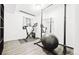 Workout area featuring gym equipment, a mirror, and a large window for ample natural light at 677 Vrain St # 15, Denver, CO 80204