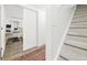 Hallway with runner rug and adjacent bedroom, features stairs and modern design at 677 Vrain St # 15, Denver, CO 80204