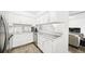 Clean and bright white kitchen with modern countertops and stainless appliances at 677 Vrain St # 15, Denver, CO 80204