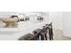 Kitchen bar with stylish seating overlooking the countertop and cabinets at 677 Vrain St # 15, Denver, CO 80204