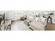 Bright living room with comfortable seating and bar overlooking the kitchen at 677 Vrain St # 15, Denver, CO 80204