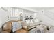 Inviting living space featuring a cozy couch and view into the kitchen at 677 Vrain St # 15, Denver, CO 80204