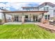 Expansive backyard with a patio, perfect for entertaining and relaxing at 10683 Amesbury Way, Highlands Ranch, CO 80126