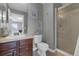 Bathroom with a single sink vanity, a shower, decorative art, and neutral finishes at 10683 Amesbury Way, Highlands Ranch, CO 80126