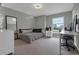 Bedroom featuring a bed, a full length mirror, a window with natural light, and a desk at 10683 Amesbury Way, Highlands Ranch, CO 80126