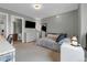 Comfortable bedroom with a dresser, a full length mirror, and neutral decor at 10683 Amesbury Way, Highlands Ranch, CO 80126