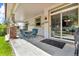 Enjoy outdoor living on this covered patio with seating and a convenient sliding door at 10683 Amesbury Way, Highlands Ranch, CO 80126