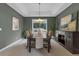 Elegant dining room featuring a dark wood table set, chandelier lighting, and stylish wall art at 10683 Amesbury Way, Highlands Ranch, CO 80126