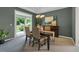 Formal dining room featuring stylish furniture, a modern chandelier, and sliding glass doors to the backyard at 10683 Amesbury Way, Highlands Ranch, CO 80126