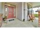 Charming front porch with seating, a red door, and a HOME welcome mat at 10683 Amesbury Way, Highlands Ranch, CO 80126