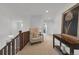 Upstairs hallway featuring a decorative hall table, railing and staircase at 10683 Amesbury Way, Highlands Ranch, CO 80126