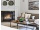 Cozy living room featuring a fireplace, comfortable seating, and stylish decor at 10683 Amesbury Way, Highlands Ranch, CO 80126