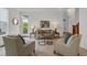 Inviting living room with stylish furnishings, decorative lamps, and lots of natural light at 10683 Amesbury Way, Highlands Ranch, CO 80126