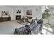 Spacious living room with fireplace, neutral decor, and comfortable seating arrangement at 10683 Amesbury Way, Highlands Ranch, CO 80126