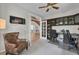 Spacious home office with custom built-ins, a ceiling fan, and double-door entry at 10683 Amesbury Way, Highlands Ranch, CO 80126