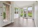 Bright living room featuring wood floors and large windows with outside views at 2824 W Centennial Dr # L, Littleton, CO 80123