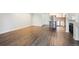 Open living area featuring wood floors that leads into the kitchen at 2824 W Centennial Dr # L, Littleton, CO 80123