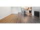 Open living area featuring wood floors that leads into the kitchen at 2824 W Centennial Dr # L, Littleton, CO 80123