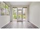 Bright living room featuring wood floors and large windows with outside views at 2824 W Centennial Dr # L, Littleton, CO 80123