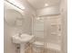 Clean bathroom featuring a shower with glass enclosure, sink, and toilet at 7858 Oban Ct, Lone Tree, CO 80124