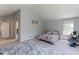 Spacious bedroom features vaulted ceilings, a large window, and neutral carpet at 7858 Oban Ct, Lone Tree, CO 80124