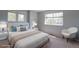 Bedroom with natural light, a plush bed, and a cozy accent chair at 7858 Oban Ct, Lone Tree, CO 80124