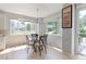 Sunny breakfast nook with large windows overlooking the backyard, perfect for casual dining at 7858 Oban Ct, Lone Tree, CO 80124